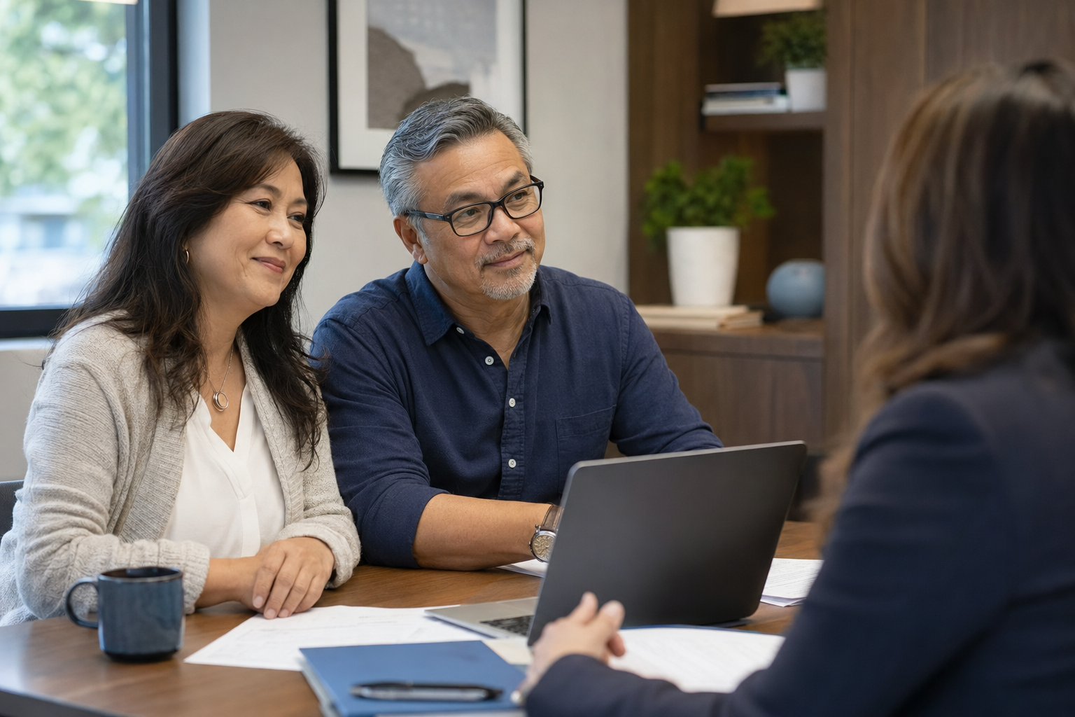 A husband and wife meeting with an accountant to review their personal taxes